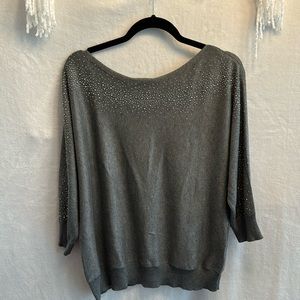 Is a half sleeve sweater from New York & Company. Beautiful for a night out.